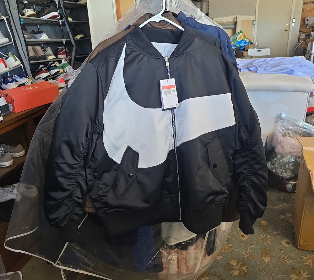 Nike Black Bomber Jacket with White Swoosh Graphic